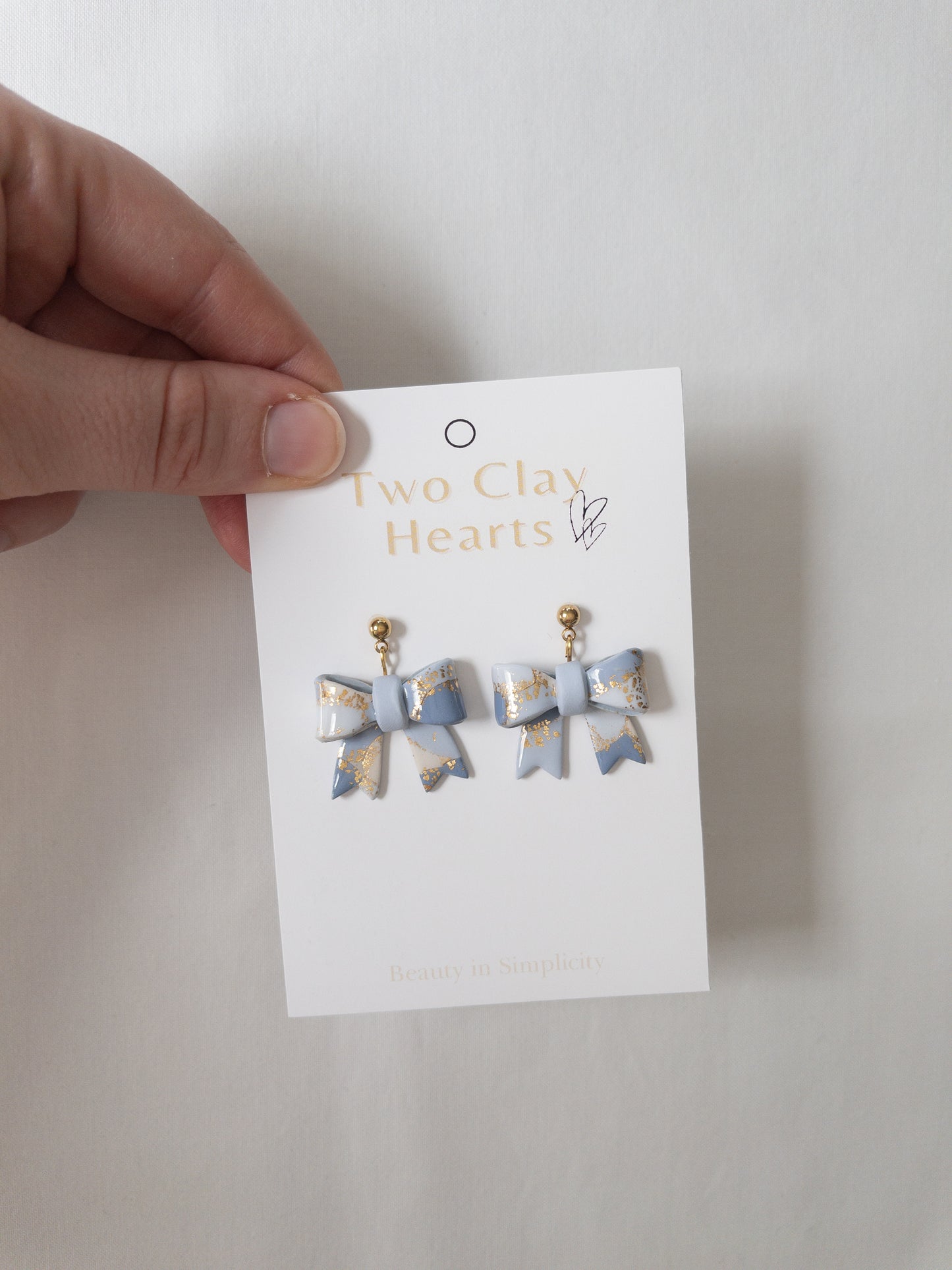 Pastel Blue Gold Leaf Bow Dangles
