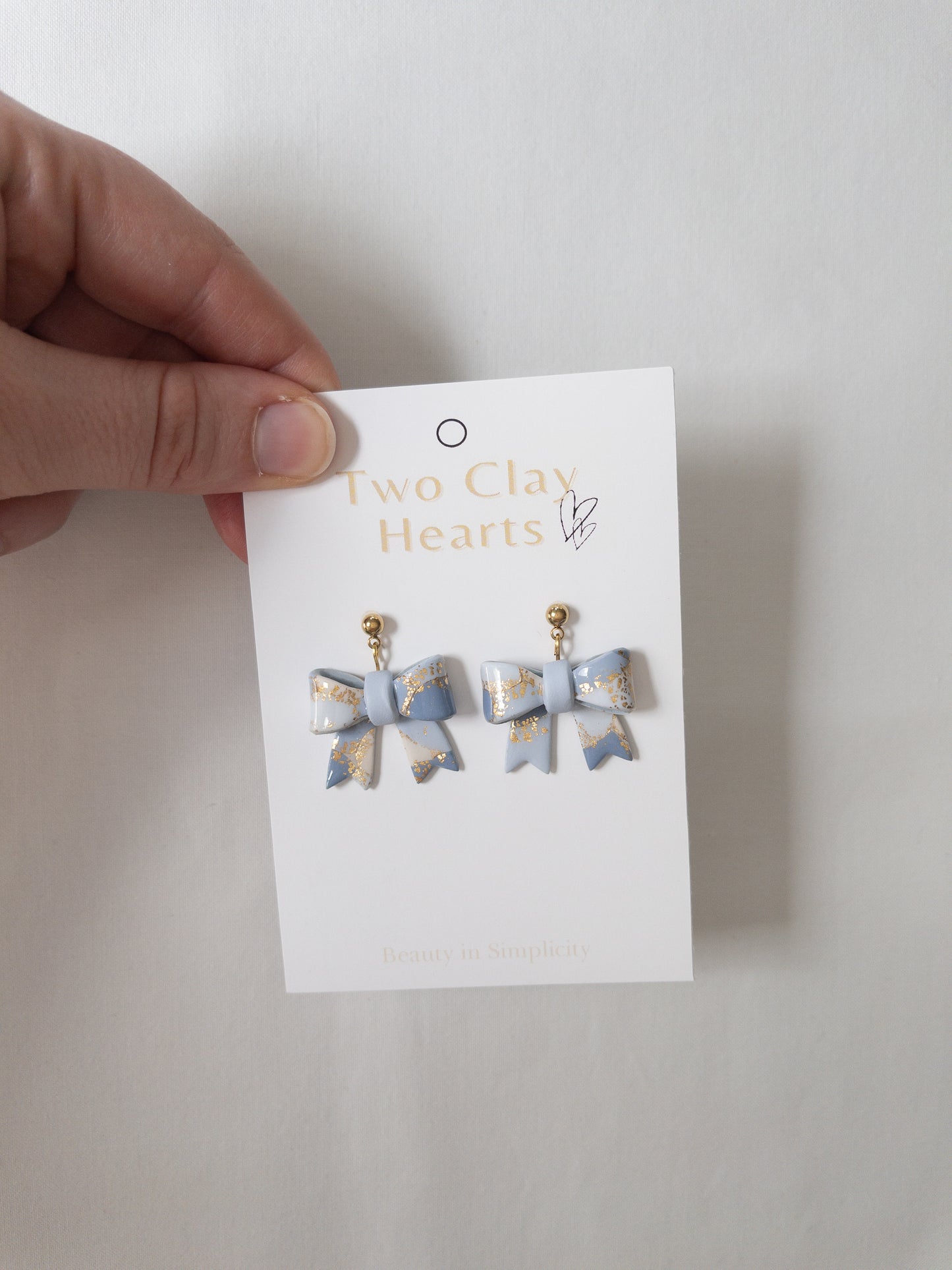 Pastel Blue Gold Leaf Bow Dangles