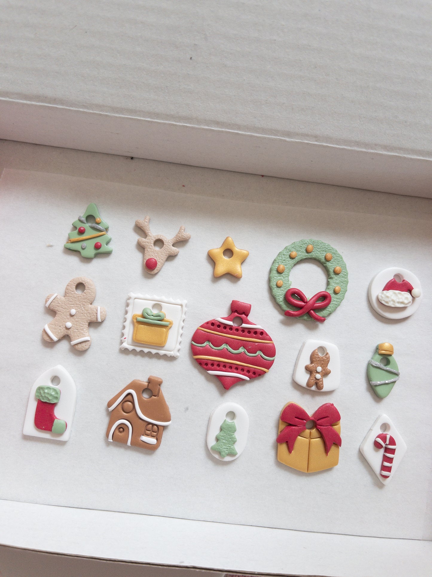 Collection of Christmas-themed hoop charms on a white surface