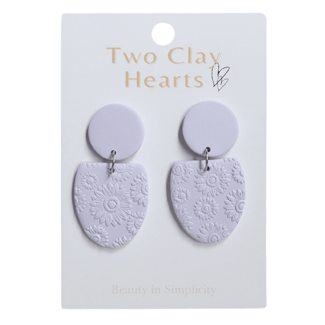 pastel purple half oval dangle earrings with a flower texture