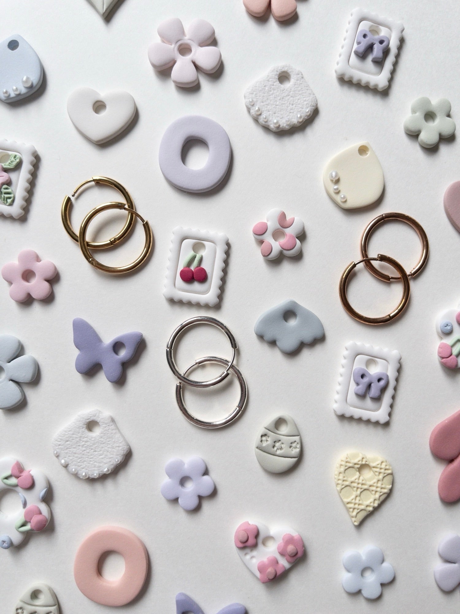 Example polymer clay hoop charms that you can make at the workshop.