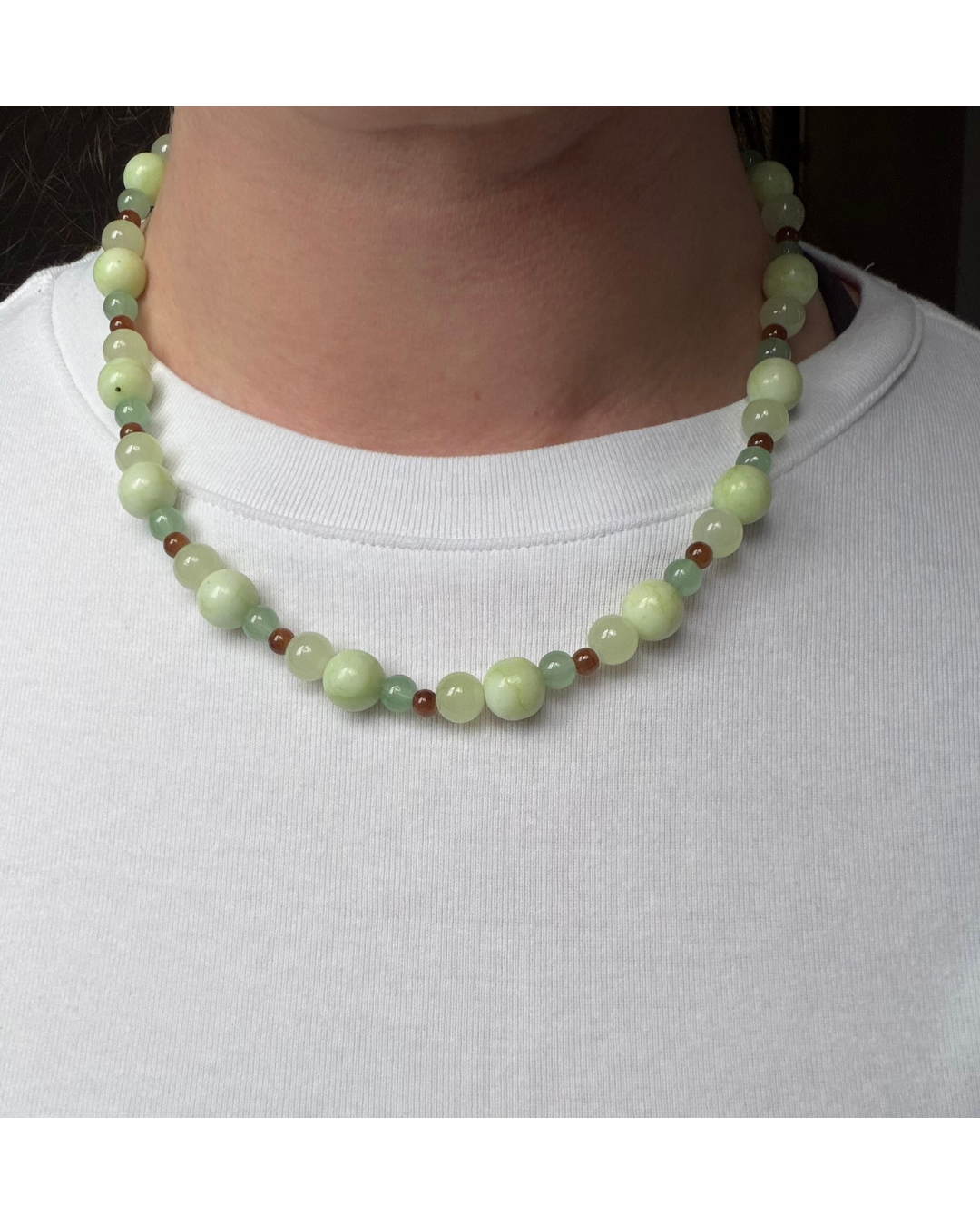 Green and brown glass beaded necklace on model