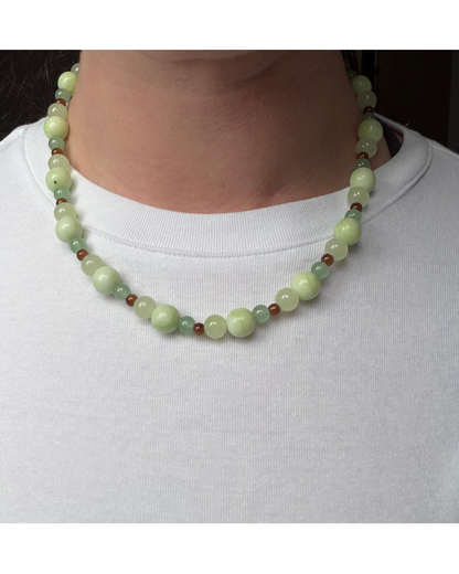 Green and brown glass beaded necklace on model