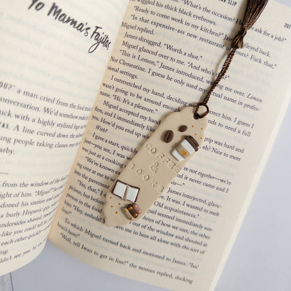 Beige and brown coffee themed bookmark on open page of book