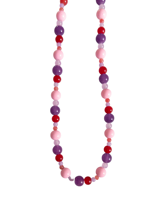Berry coloured beaded necklace on white background
