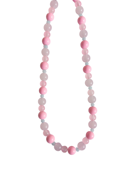Pink and blue beaded necklace on white background