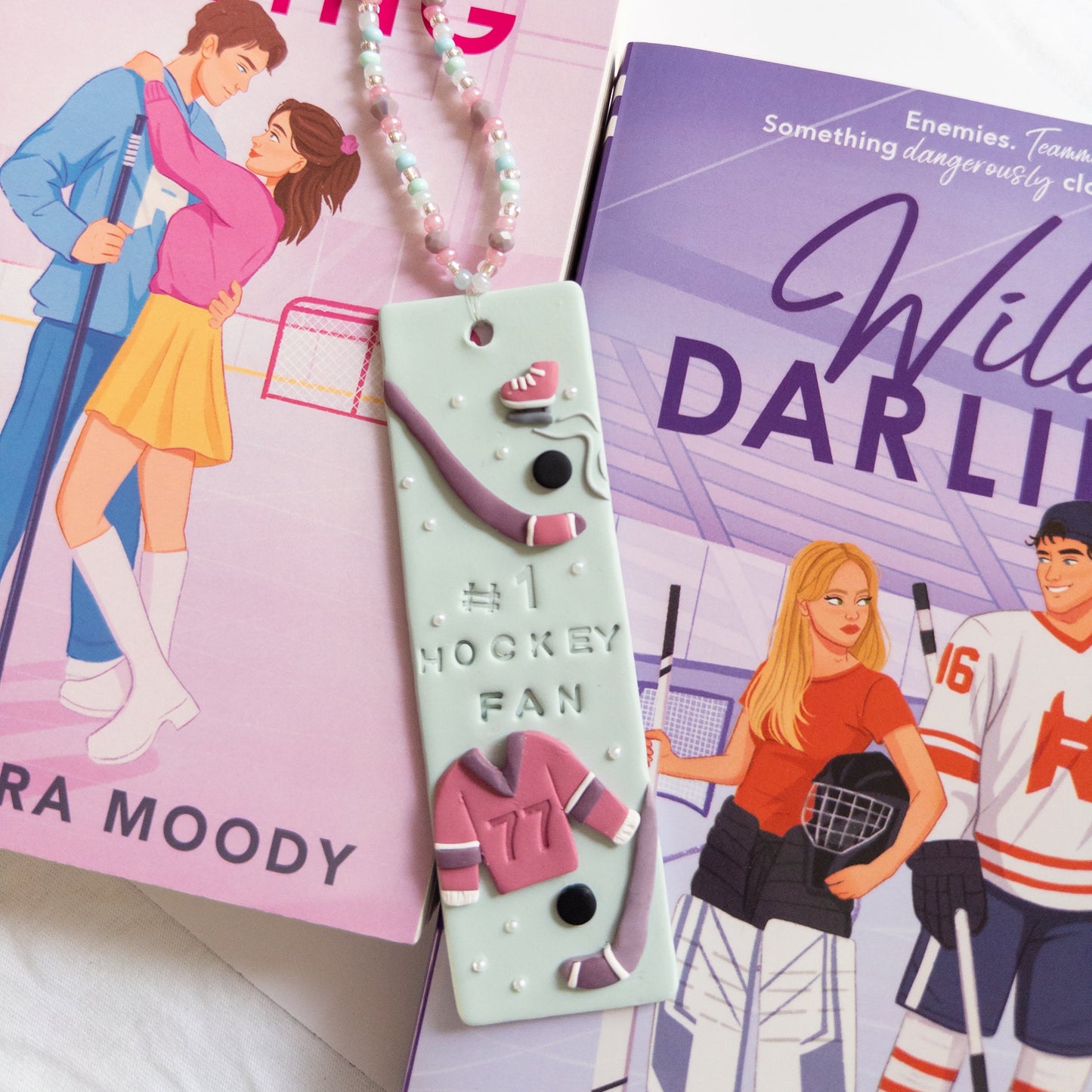 Hockey themed polymer clay bookmark on hockey books