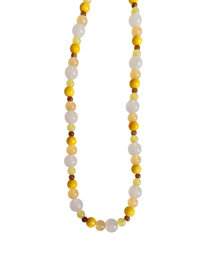 Yellow, brown and clear beaded necklace on white background