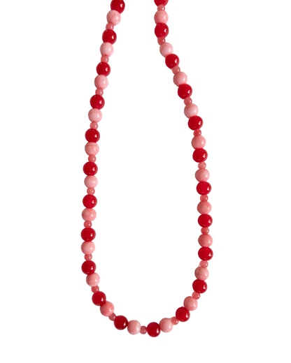 Red and Pink beaded necklace on a whitebackground