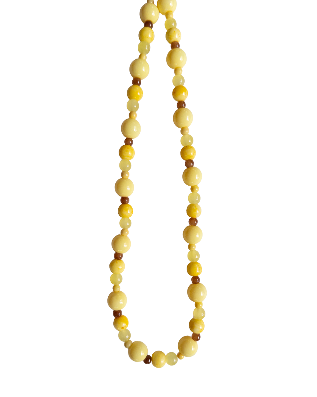 Yellow and brown beaded necklace on white background