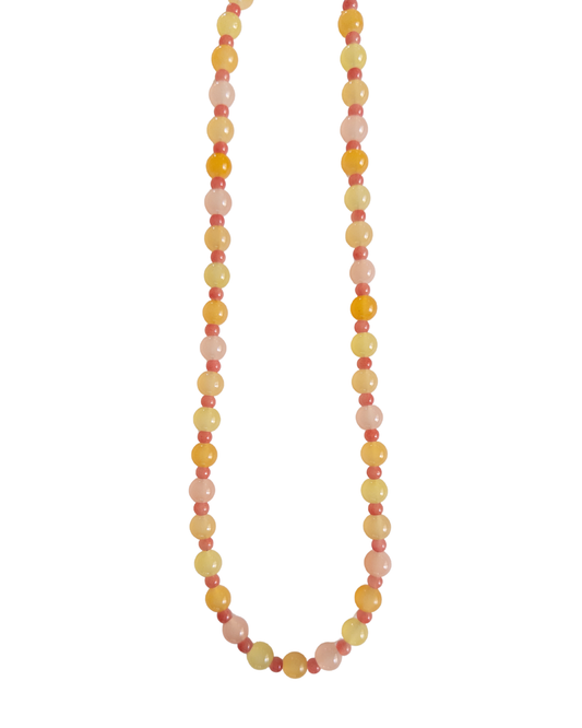 Orange, yellow and pink beaded necklace on a white background