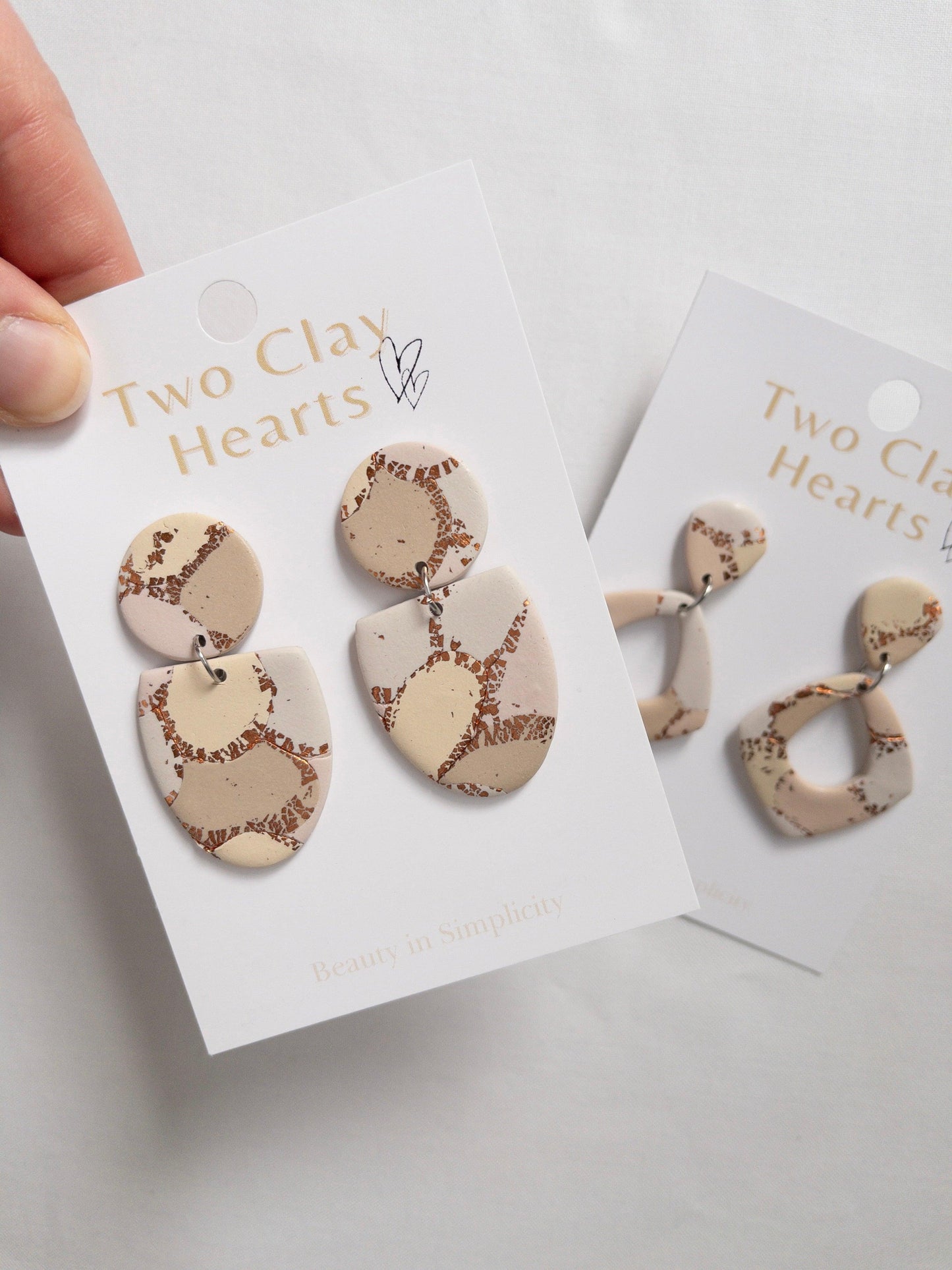 Tan and copper patternedl dangle earrings