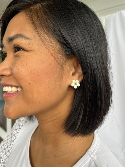 green flower stud earrings on models ear