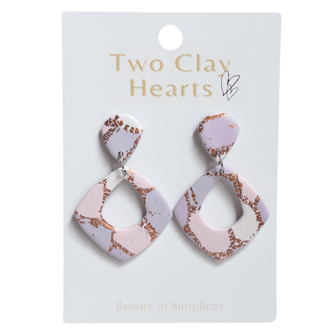 Pink, purple and rose gold patterned diamond shaped dangle earrings