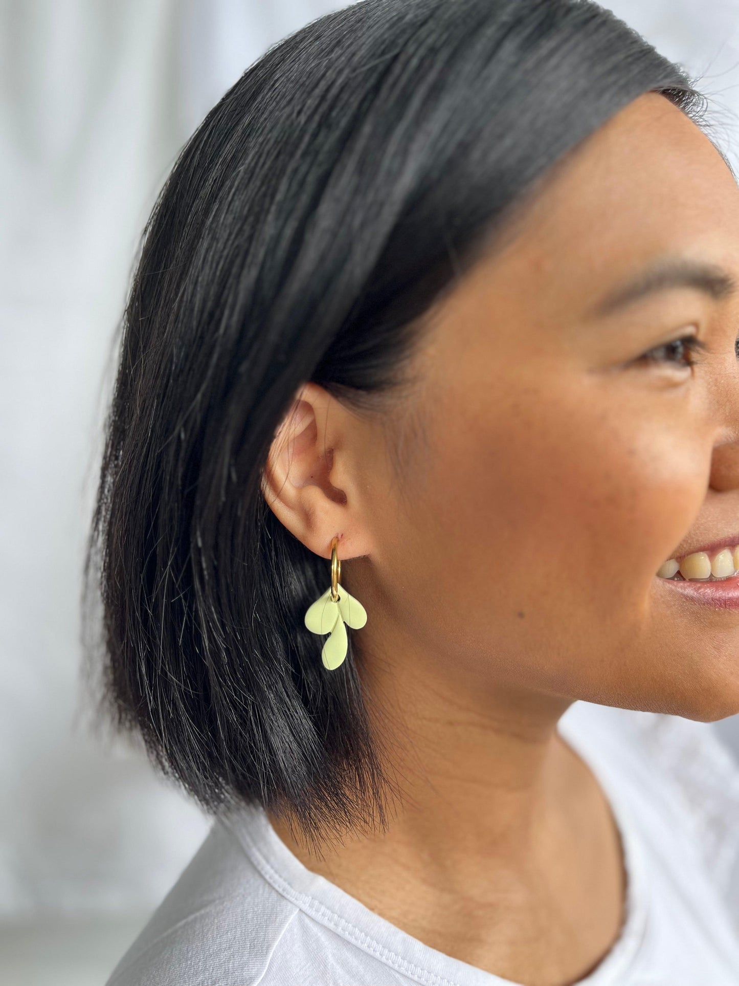 Example of leaf hoop earring on models ear