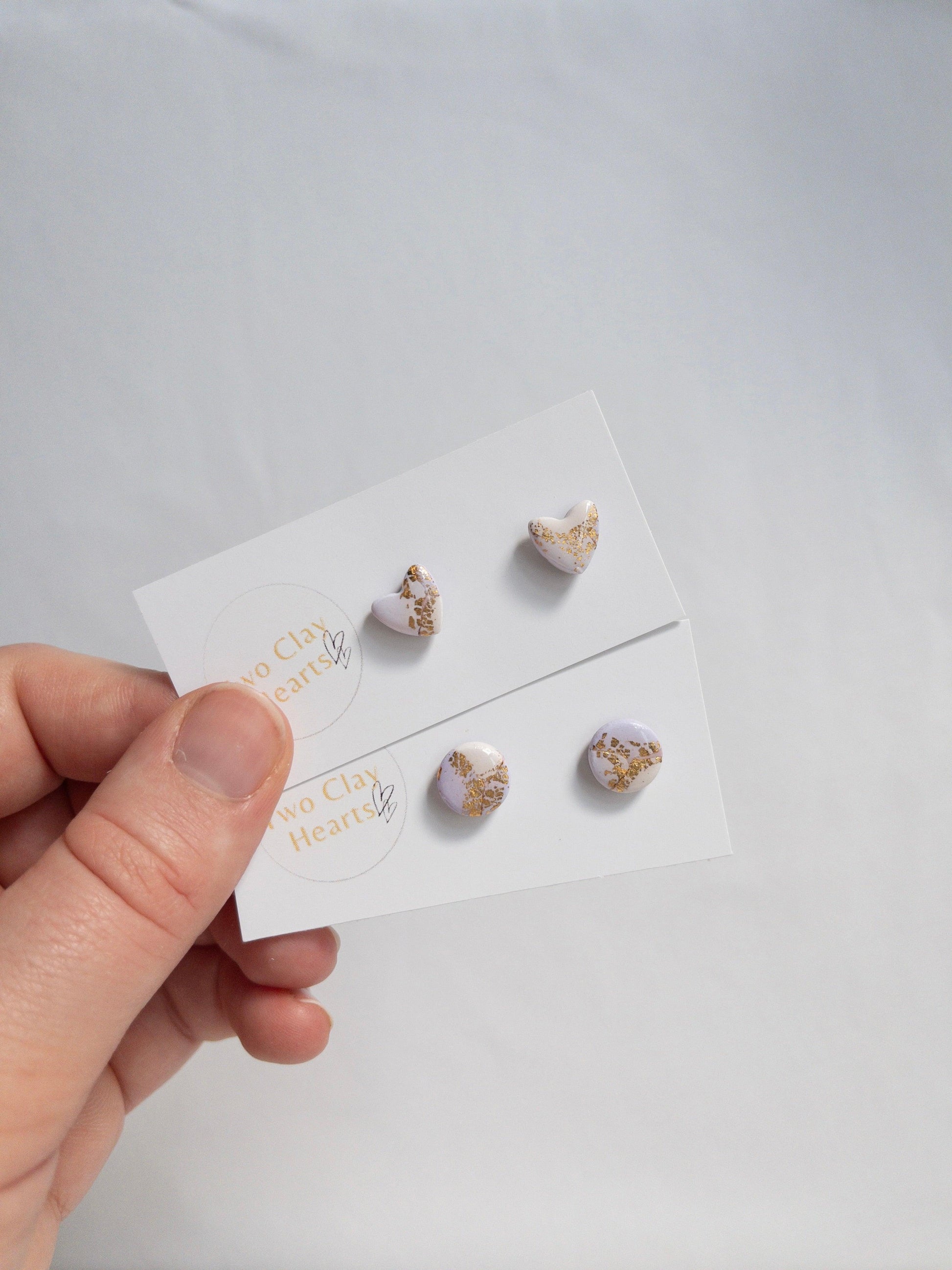 small circle and heart stud earrings in purple and gold colours inspired by taylor swifts speak now colours