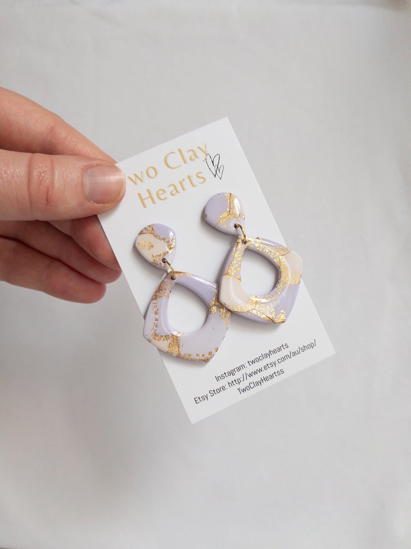 purple dangle earrings with flecks of gold leaf