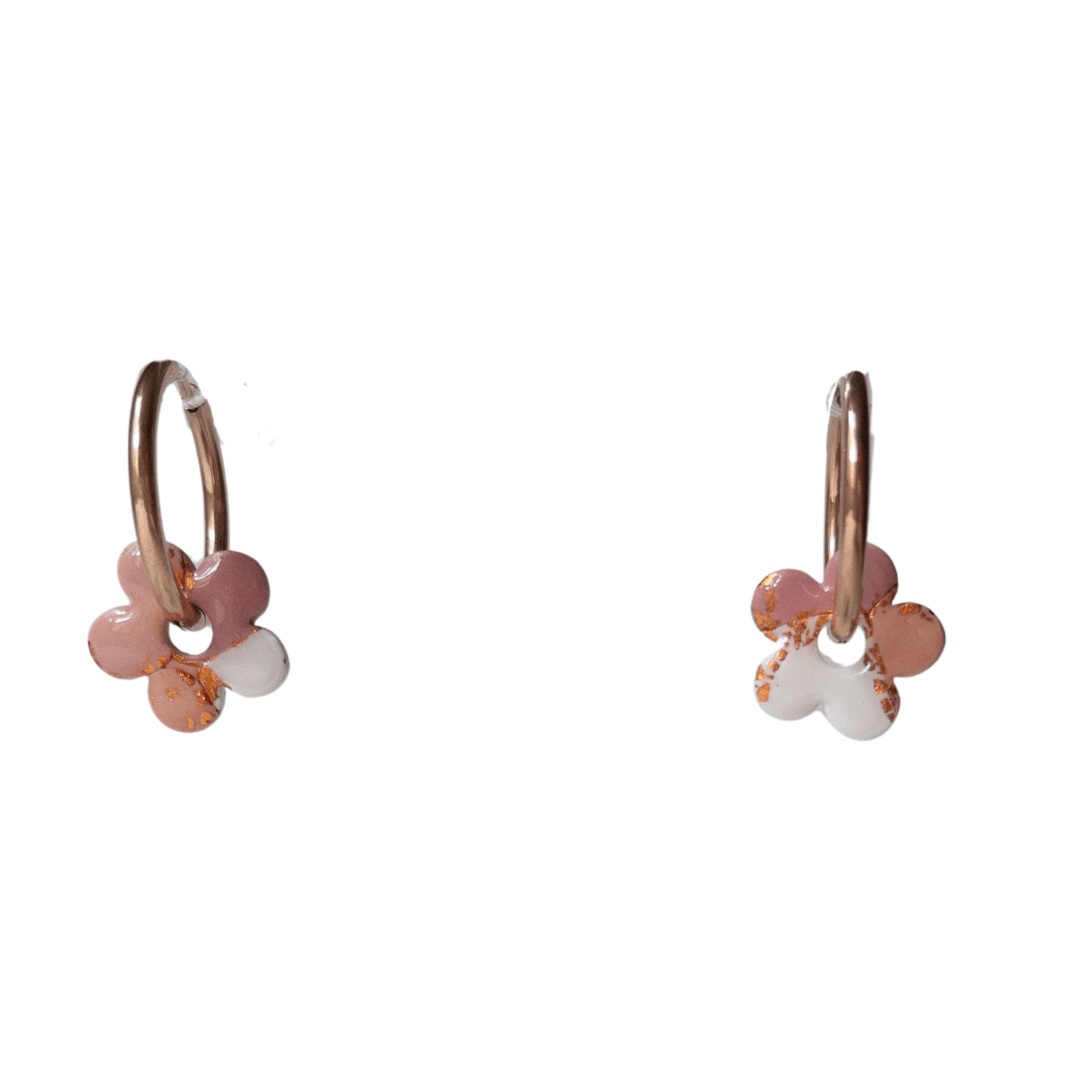 Close up on maroon, orange and rose gold small flower hoop earrings