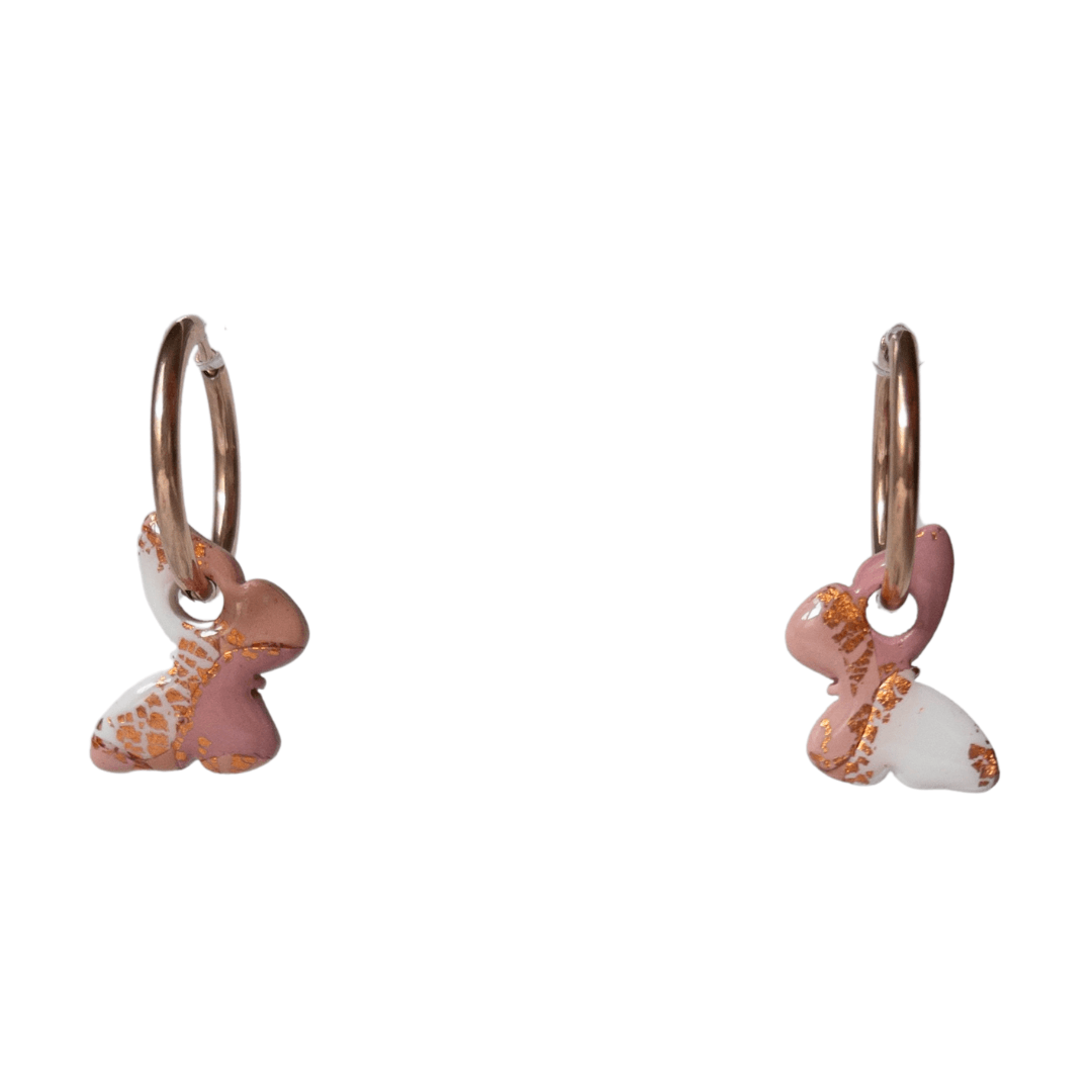 Close up on maroon and rose gold, small butterfly hoop earrings