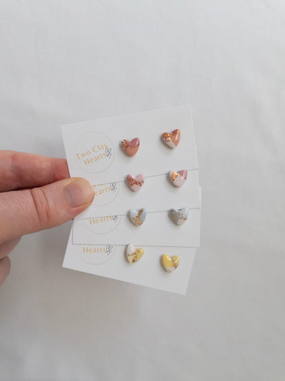 Mini pastel and gold heart stud earrings on white card