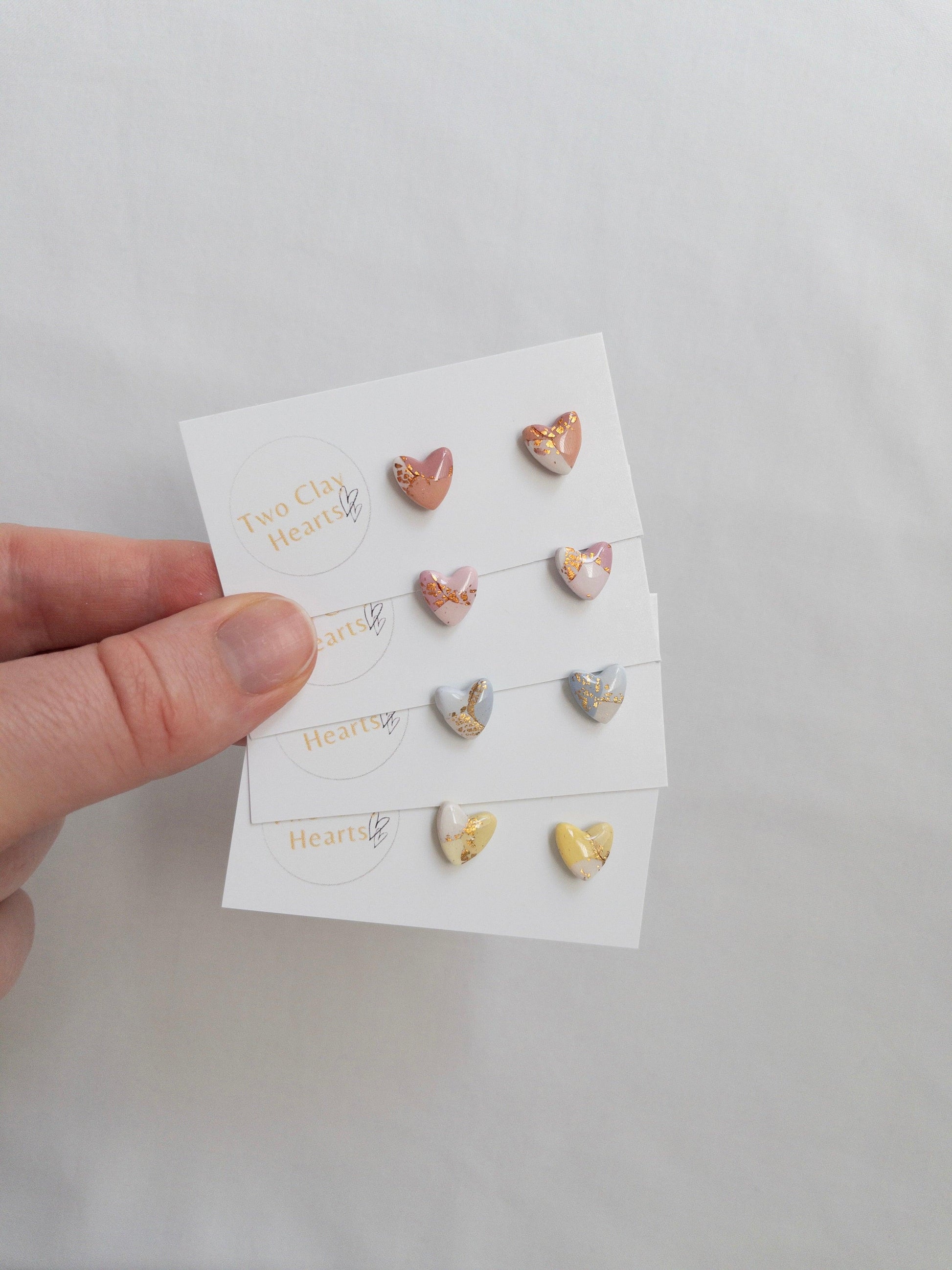 Mini pastel and gold heart stud earrings on white card