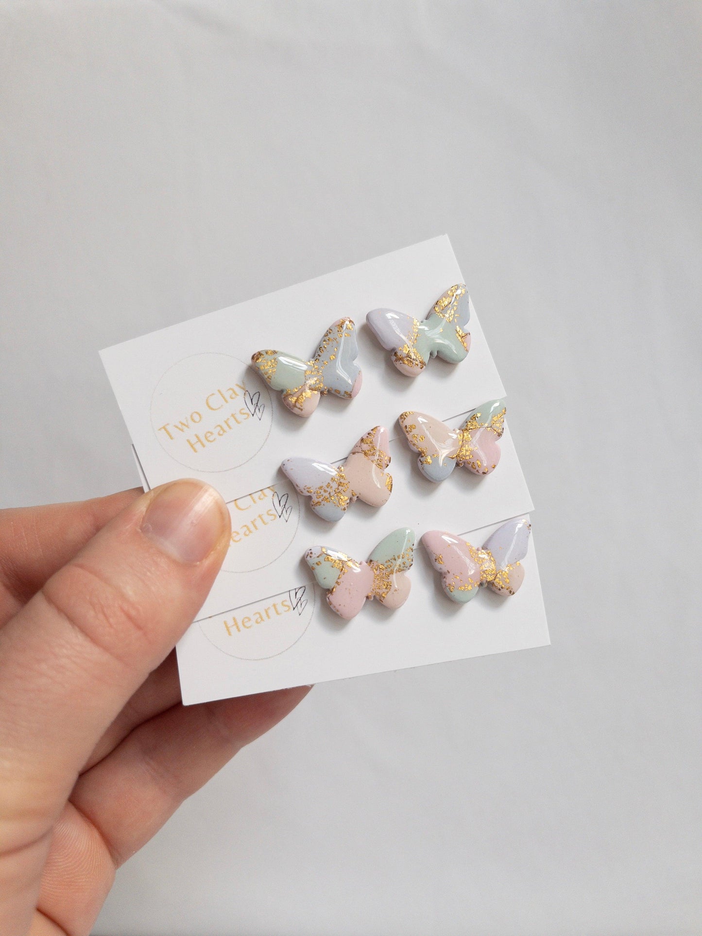 pastel multicoloured butterfly studs earrings with gold flecks