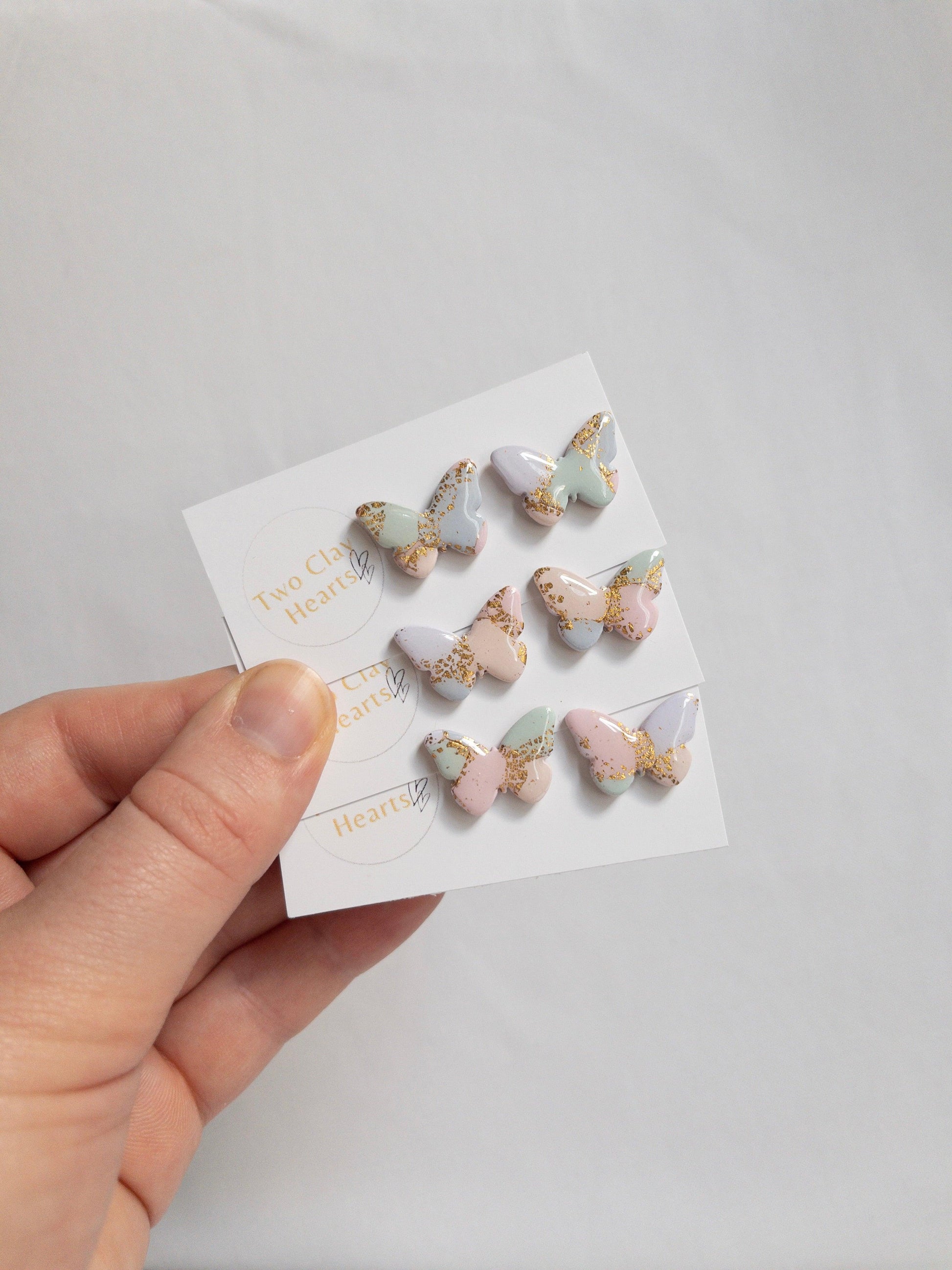 pastel multicoloured butterfly studs earrings with gold flecks