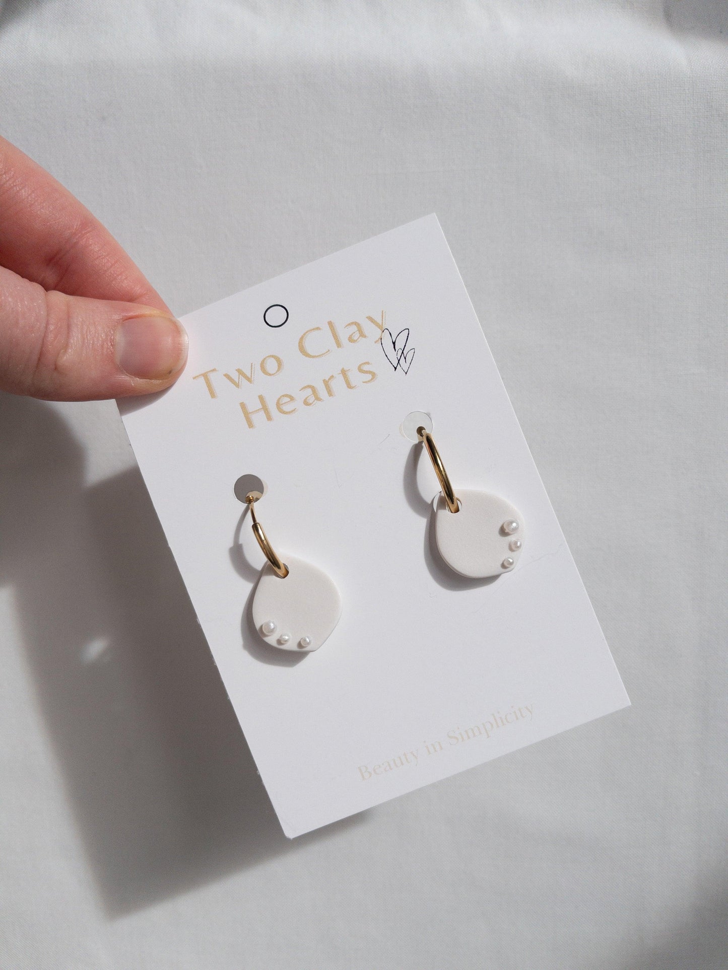 Pearly White Clay Teardrop Hoops - Two Clay Hearts