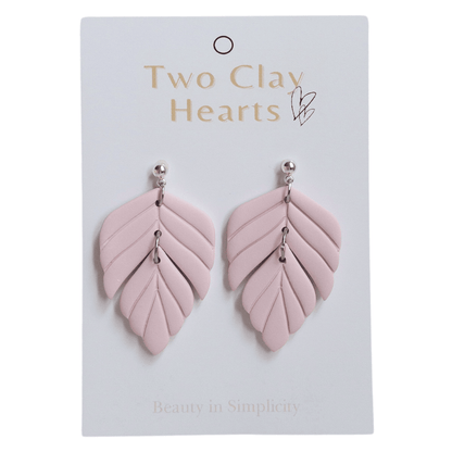 Pink polymer clay statement earring on white backing card