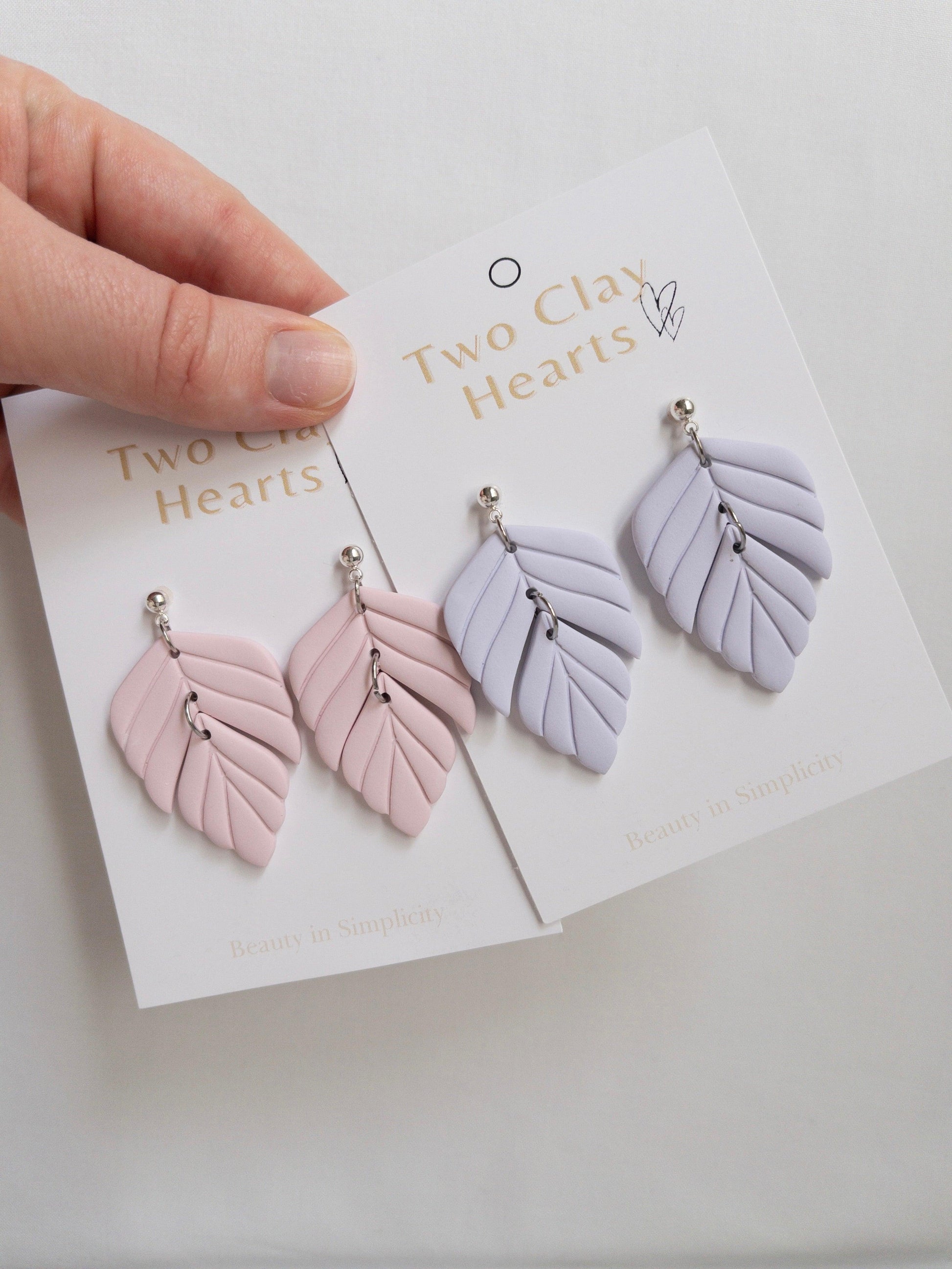 Polymer clay statement earrings on white backing card