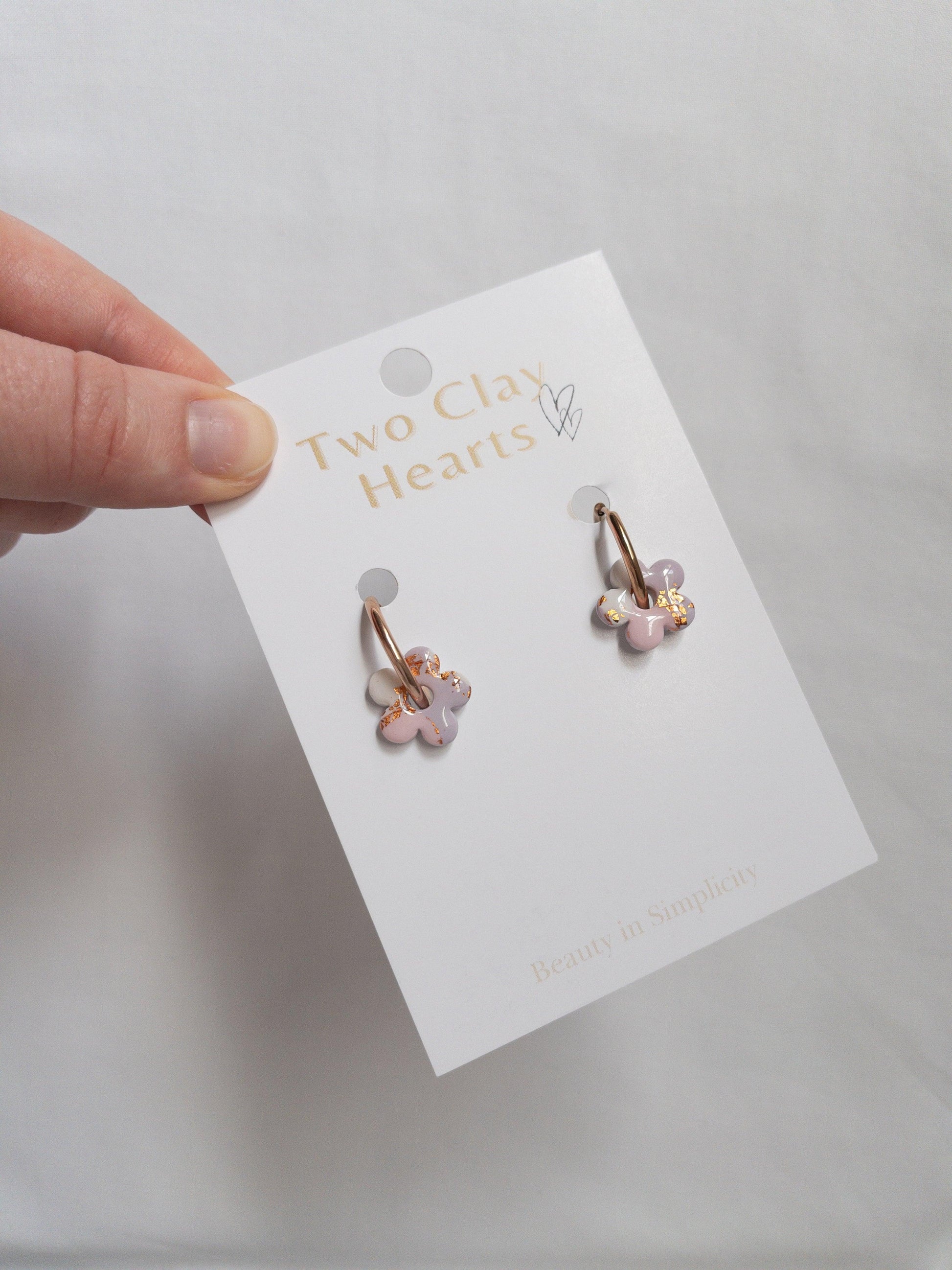 Pink, purple and rose gold small flower hoops on backing card