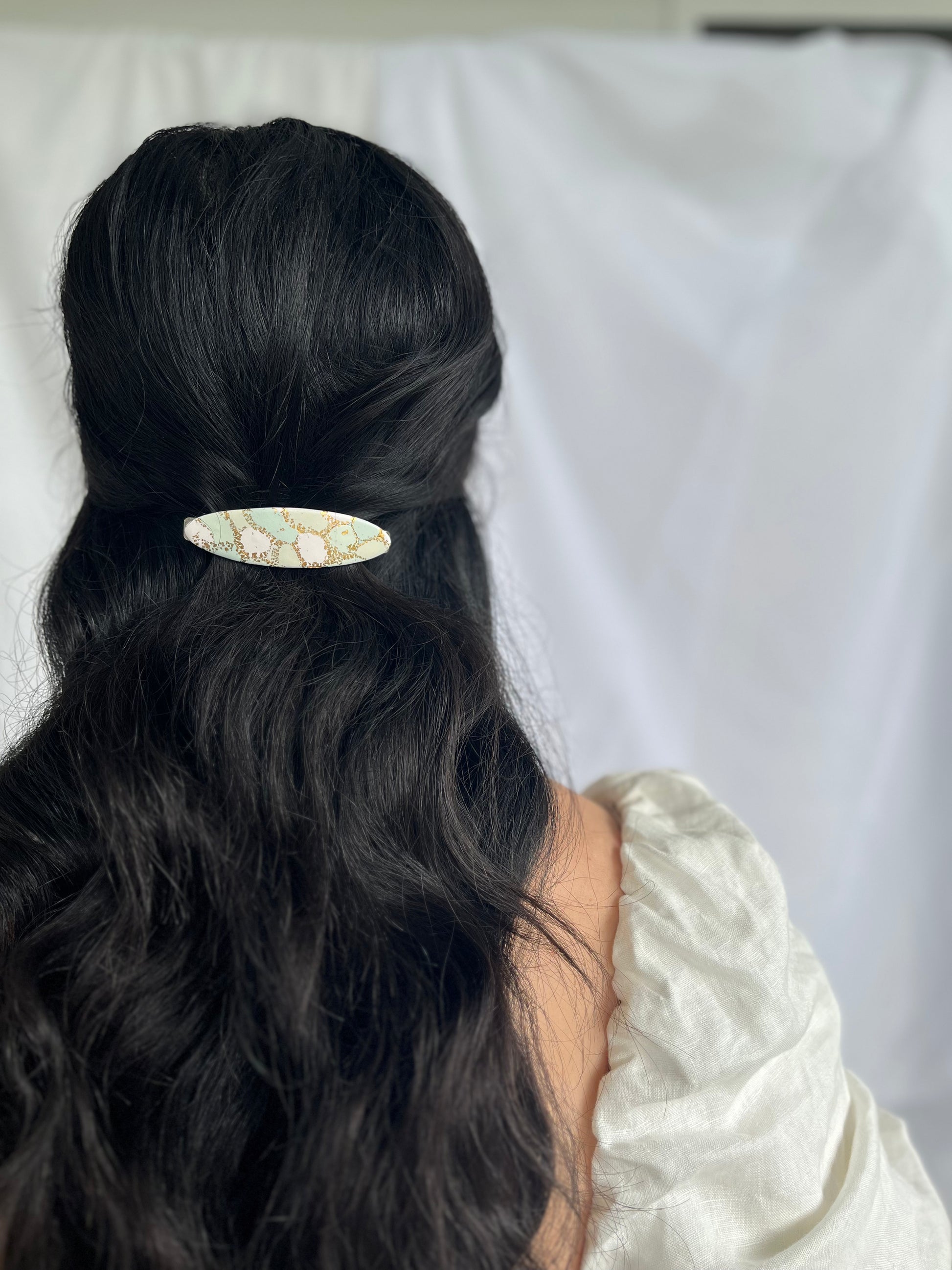 Example of polymer clay oval hair clip in models hair