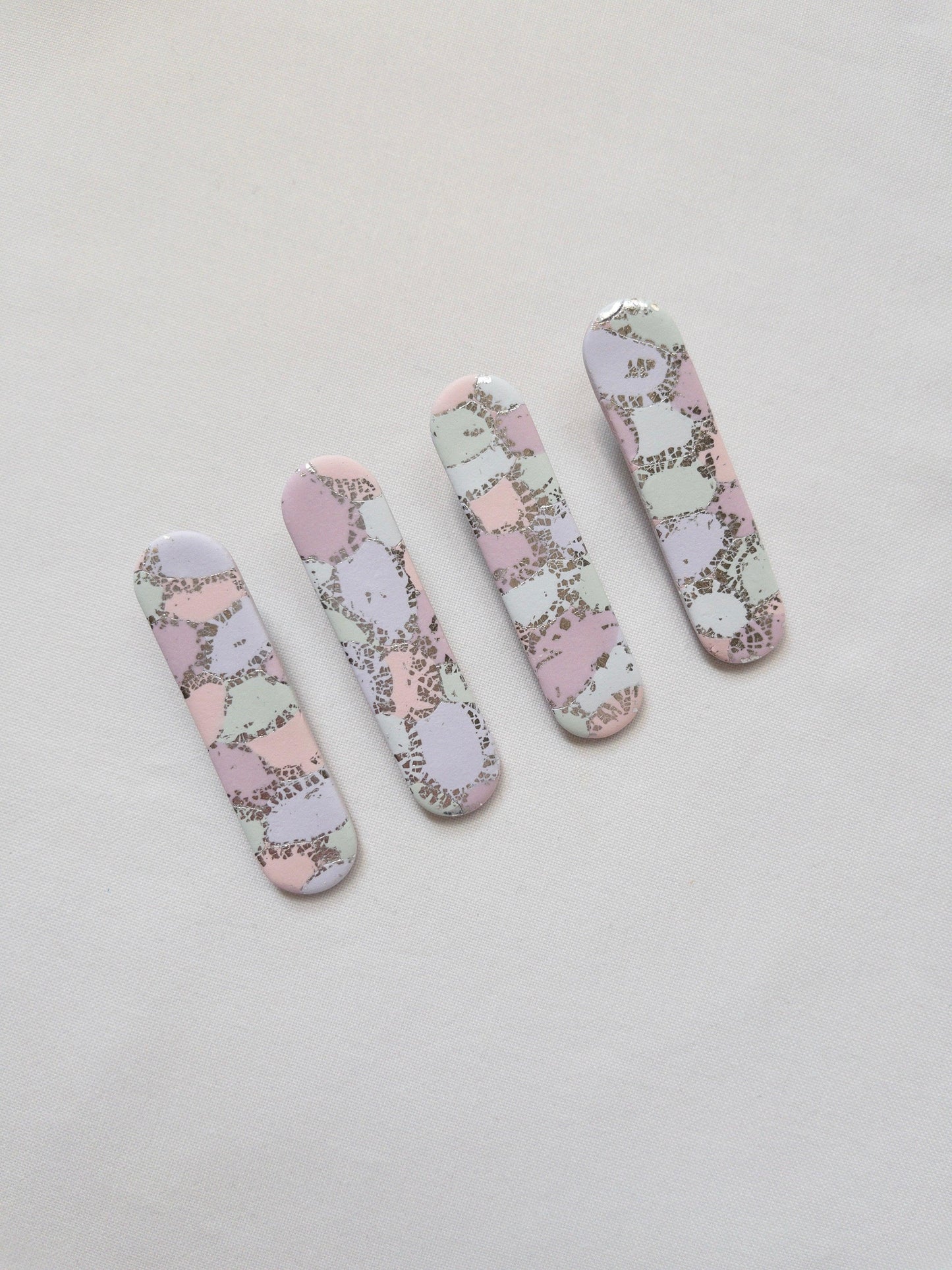 rainbow pastel coloured polymer clay hair clips with silver flecks throughout