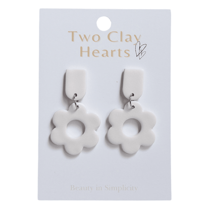 Retro flower shaped dangles in an off white / cream colour