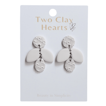 Firefly shaped dangle earrings in an off-white/cream colour