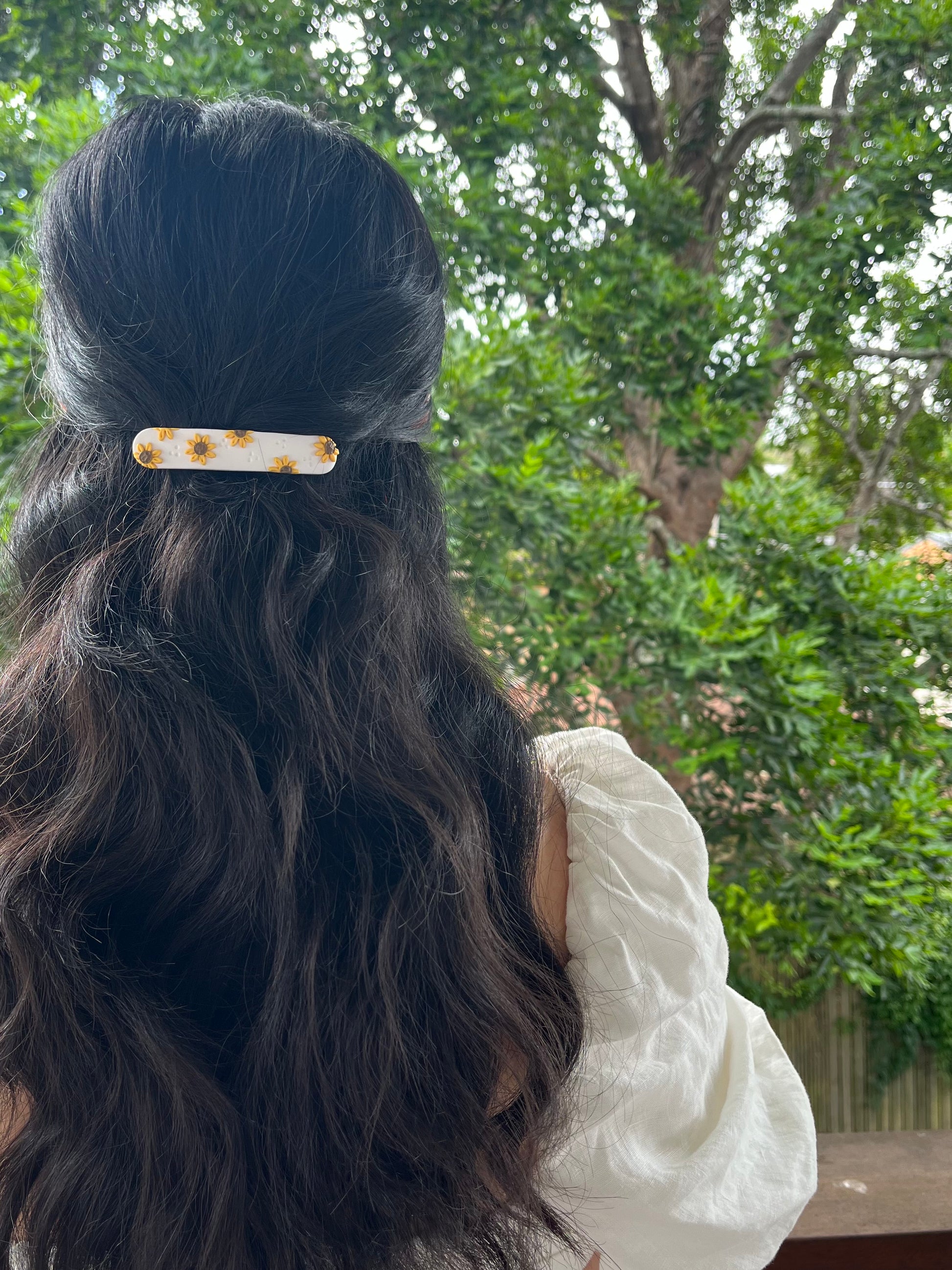 Sunflower polymer clay hair barrette in models hair