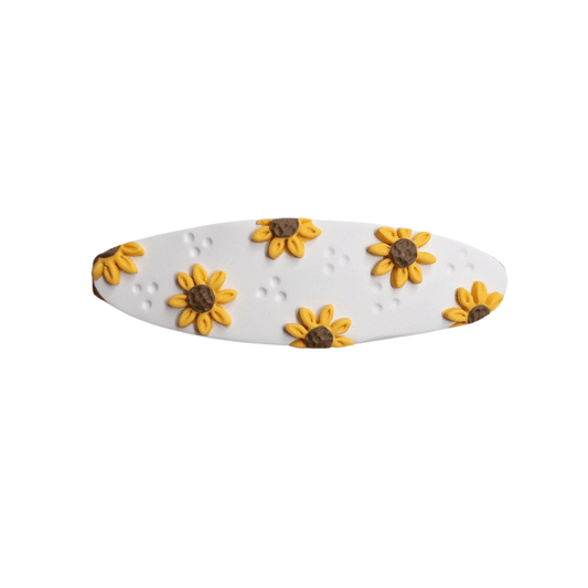 Close up on sunflower polymer clay hair barrette